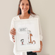 Artist Rita Carvalho holds her favorite drawing of Jimmy Garappolo.